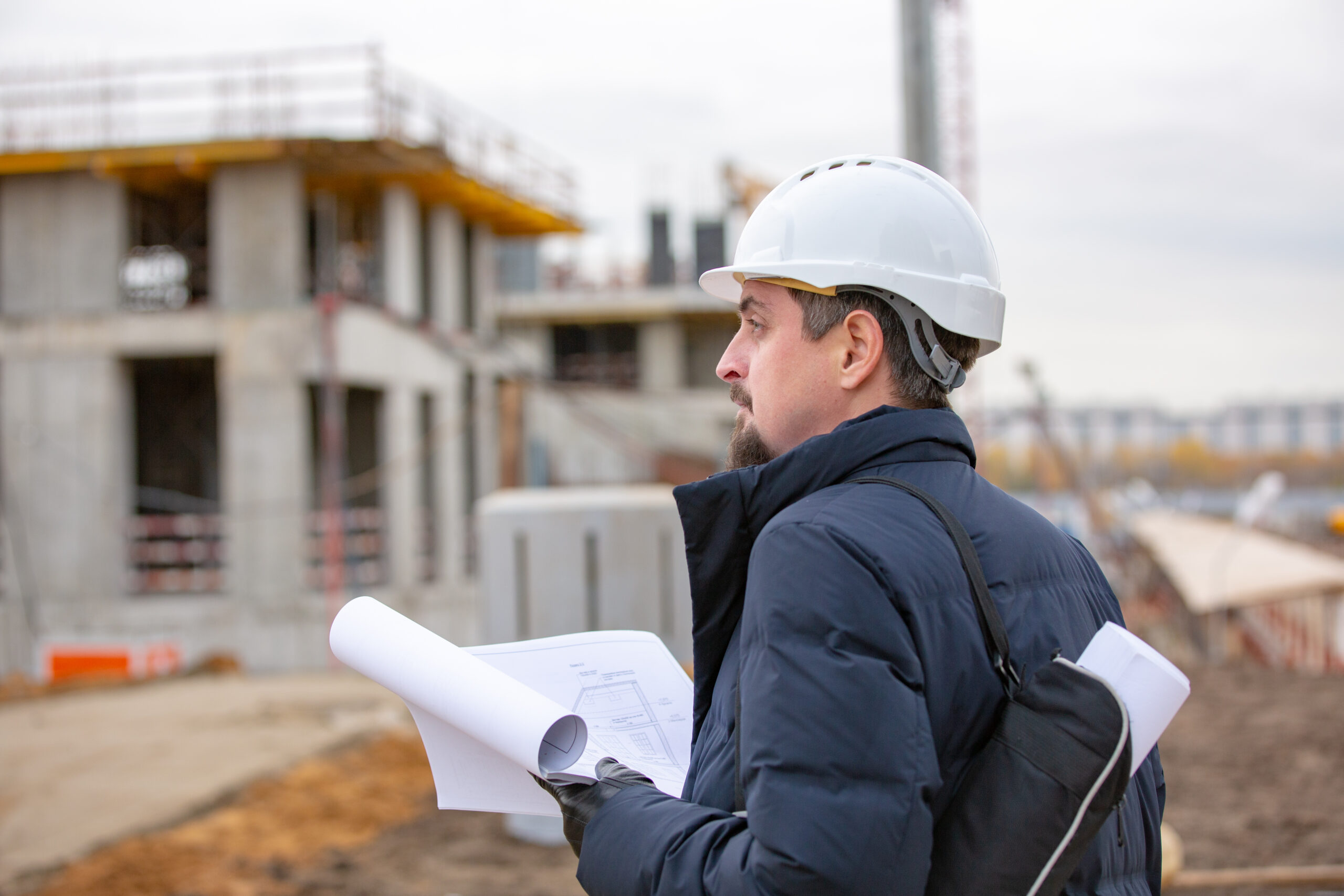 Portrait,Of,Architect,At,Work,With,Helmet,In,A,Construction